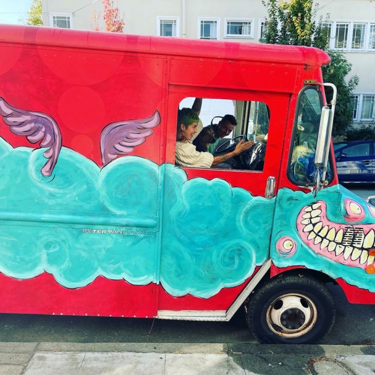 Big Mouth Collective in brightly painted van