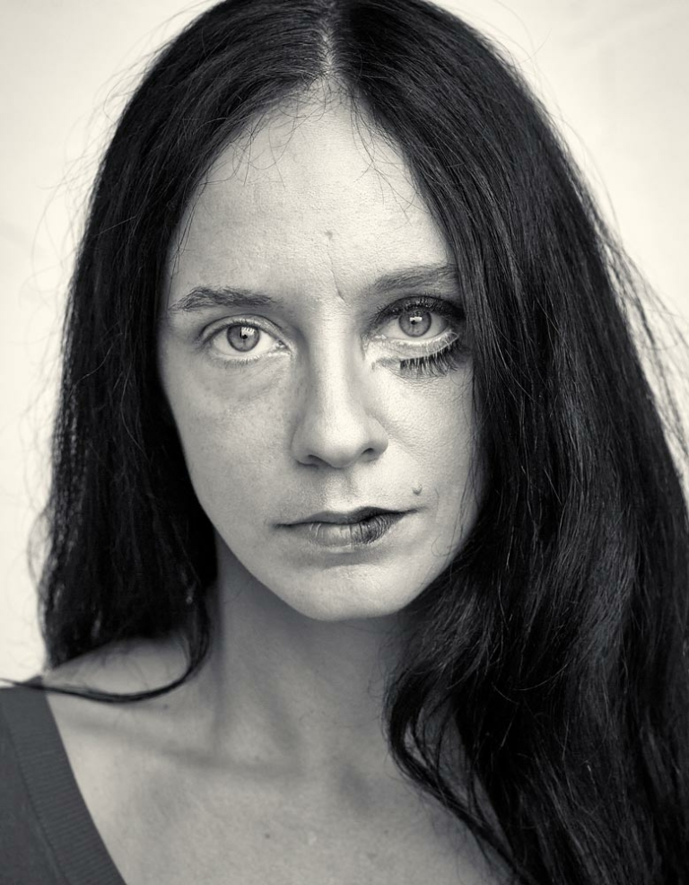 portrait woman with false eyelashes below one eye