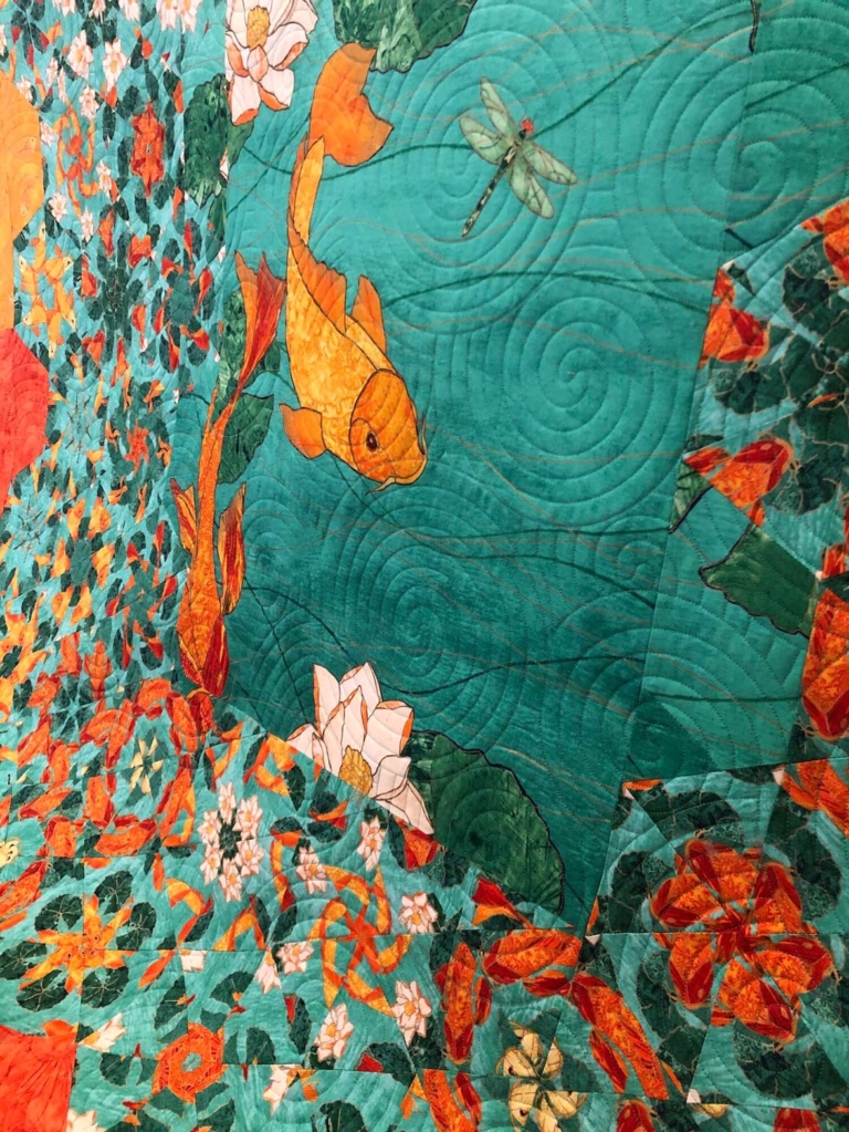 Quilt with fish in pool
