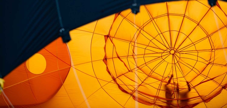 orange fabric stretched over frame