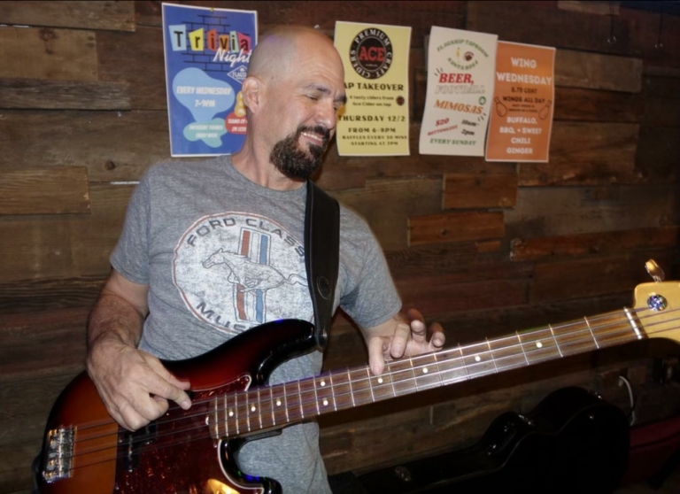 Electric guitaplayer in band