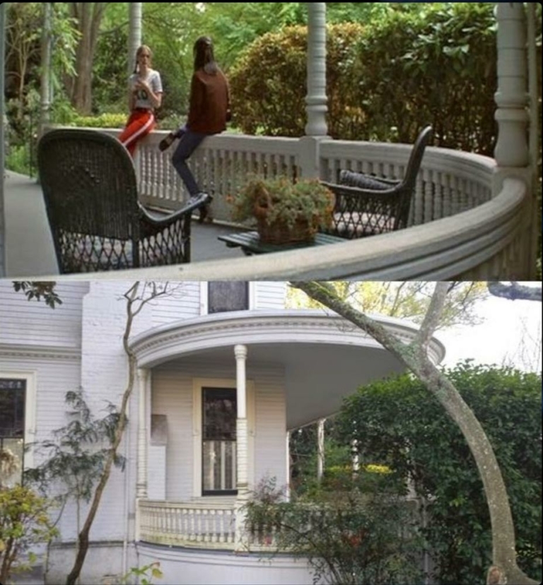 two people sitting on a ledge