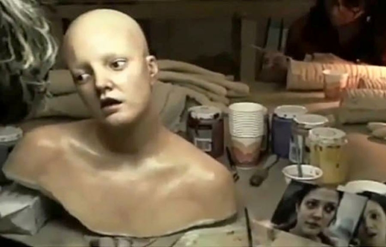 a bust of a human with no hair