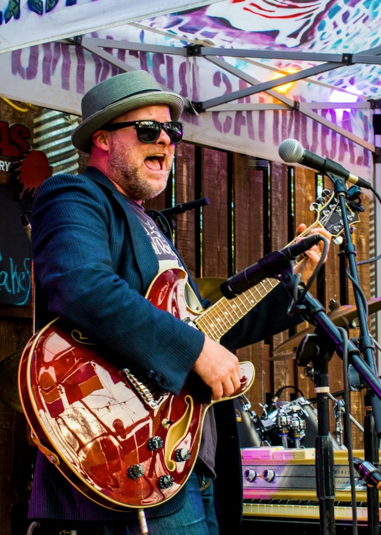 Spike Sikes playing guitar and singning