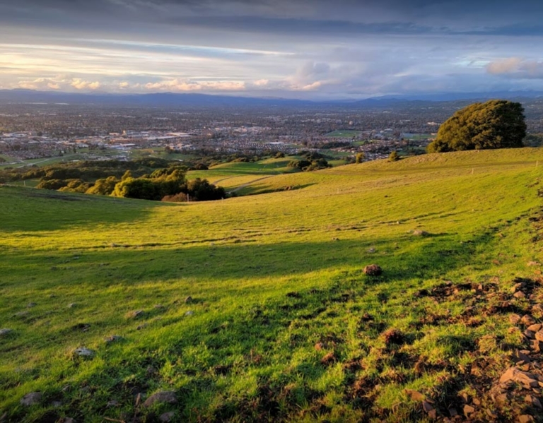 a view from the mountain at sunset