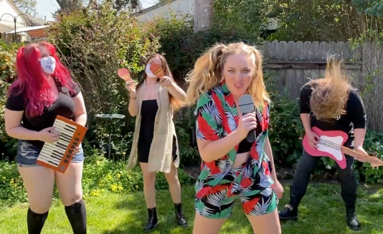 Musicians pretending to play on cardboard instruments