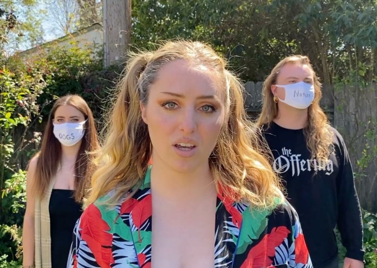 3 musicians 2 with masks with words written on