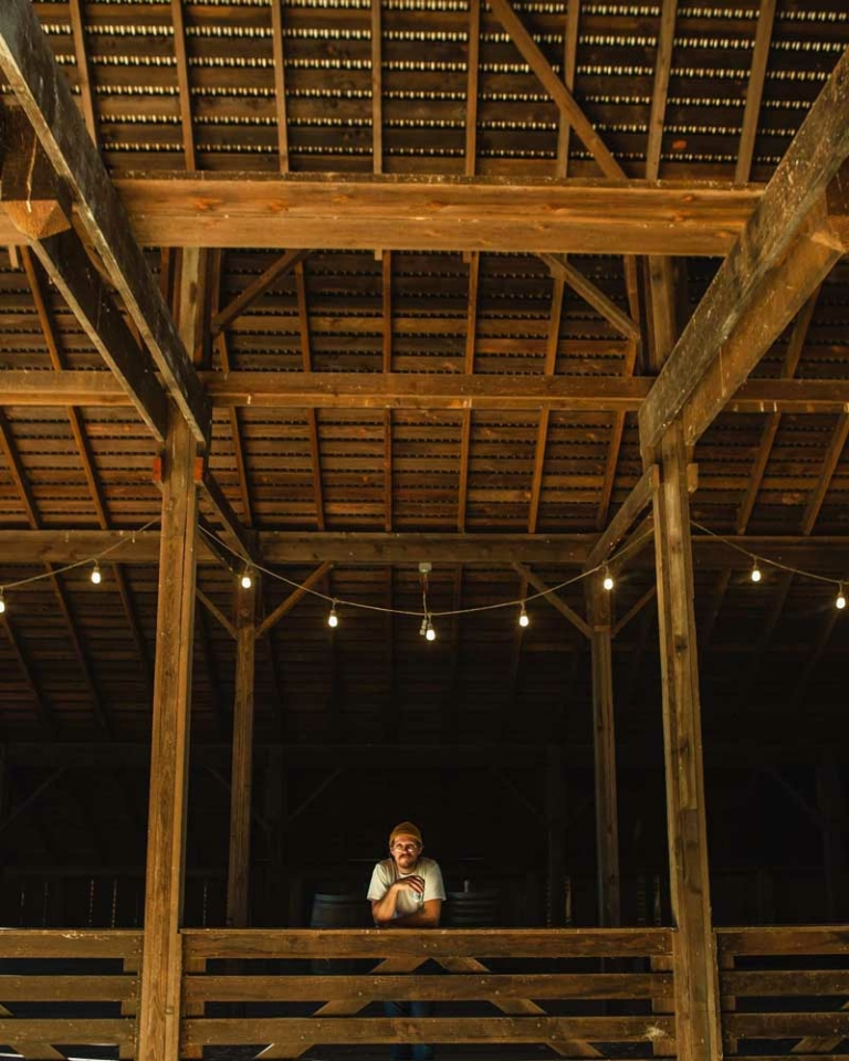 Eric long in large wooden structure
