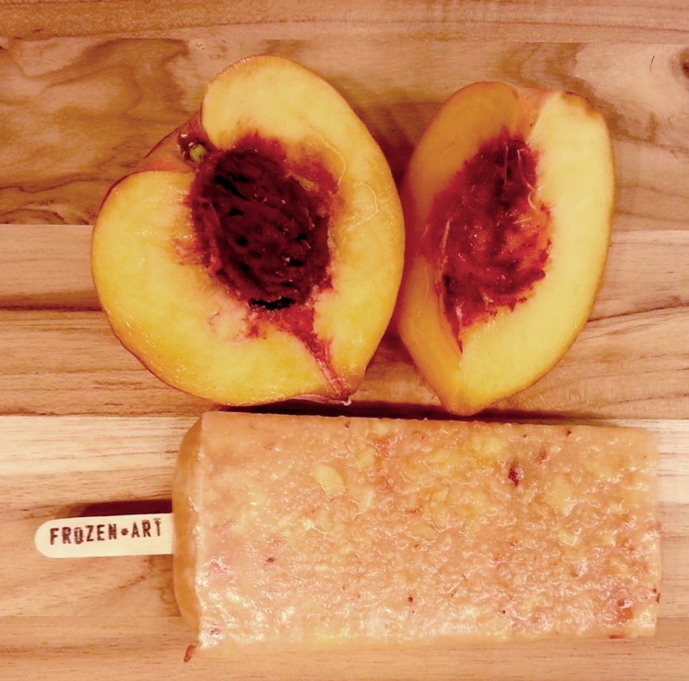fresh peaches next to peach popsicle