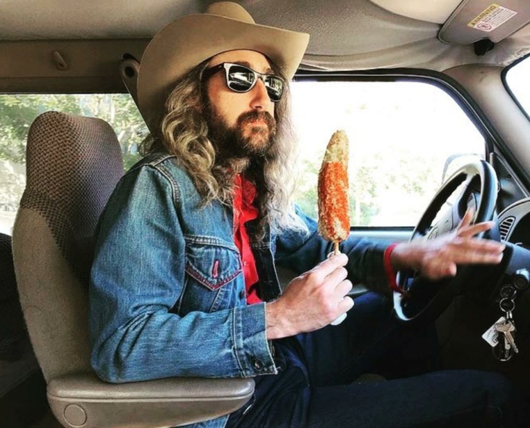 Kevin Carducci driving with corn on cob