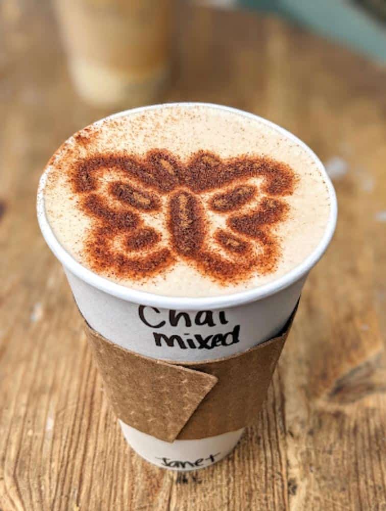 Cup of Chai with butterfly design from Crooks Coffee