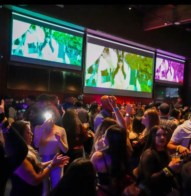 dancers at Victory House in Santa Rosa with screens behind