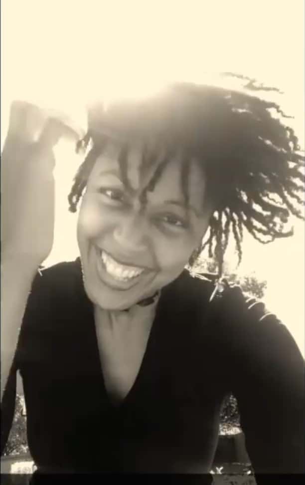 Eki Shola smiling sepia photo