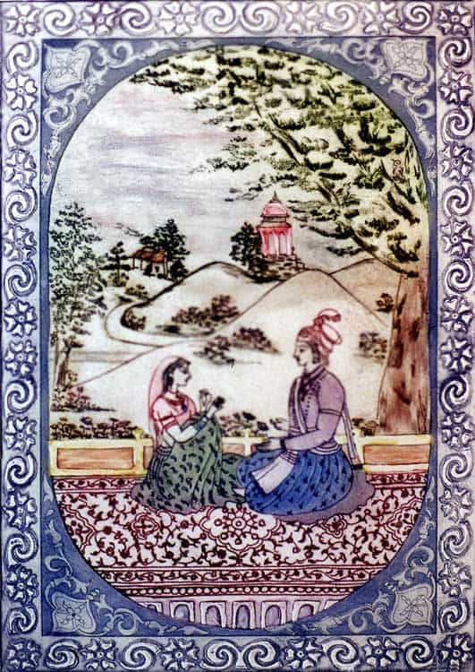 couple sitting together under tree