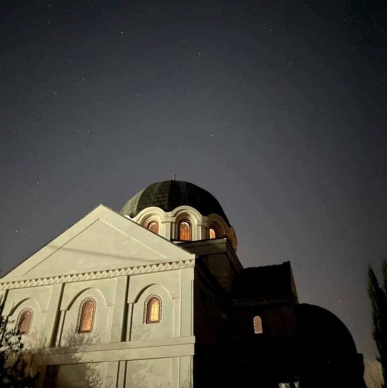 exterior of St. Seraphim with night sky